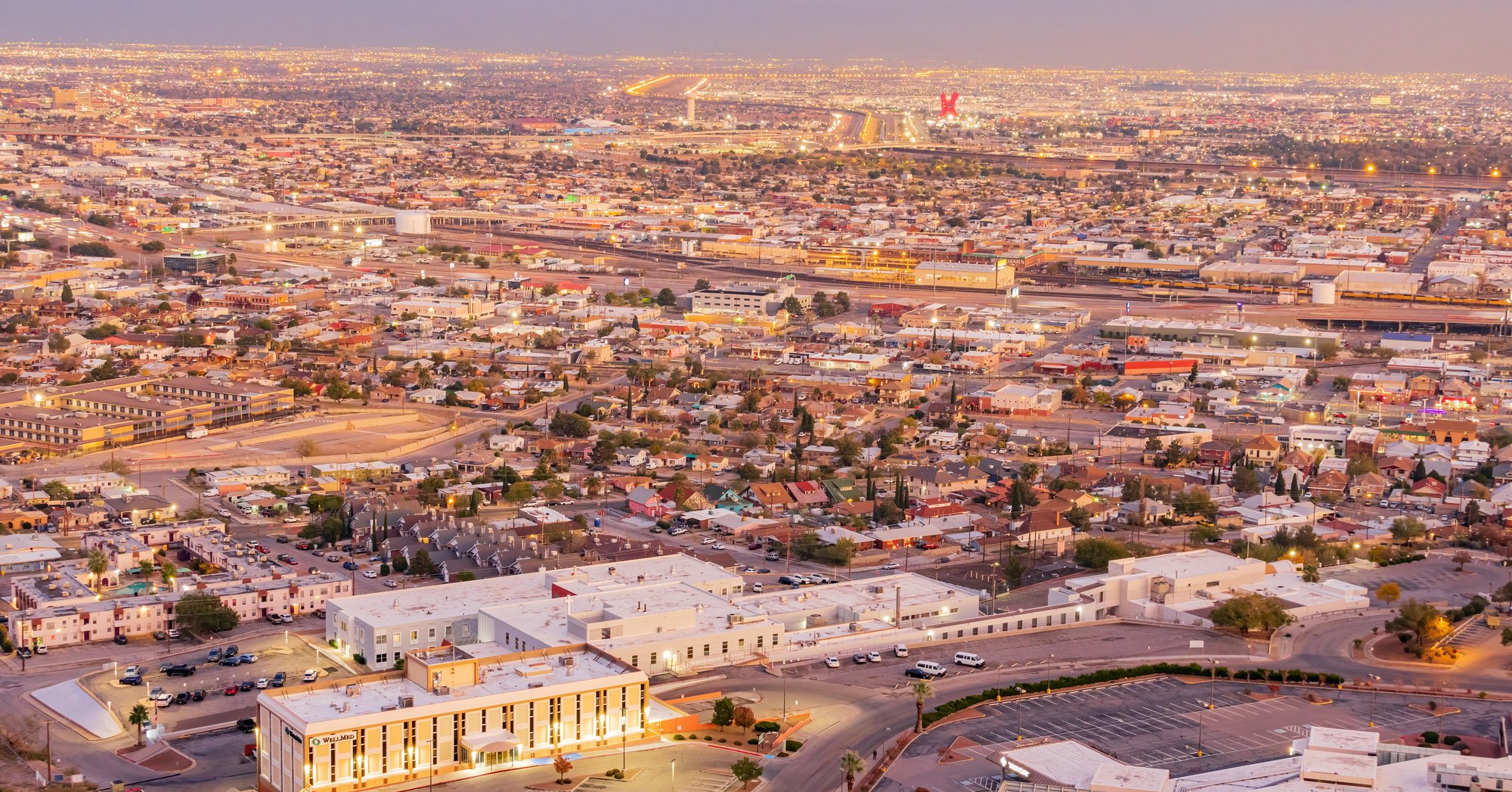 Aerial view of El Paso, Texas at dusk, looking toward the border and Juarez